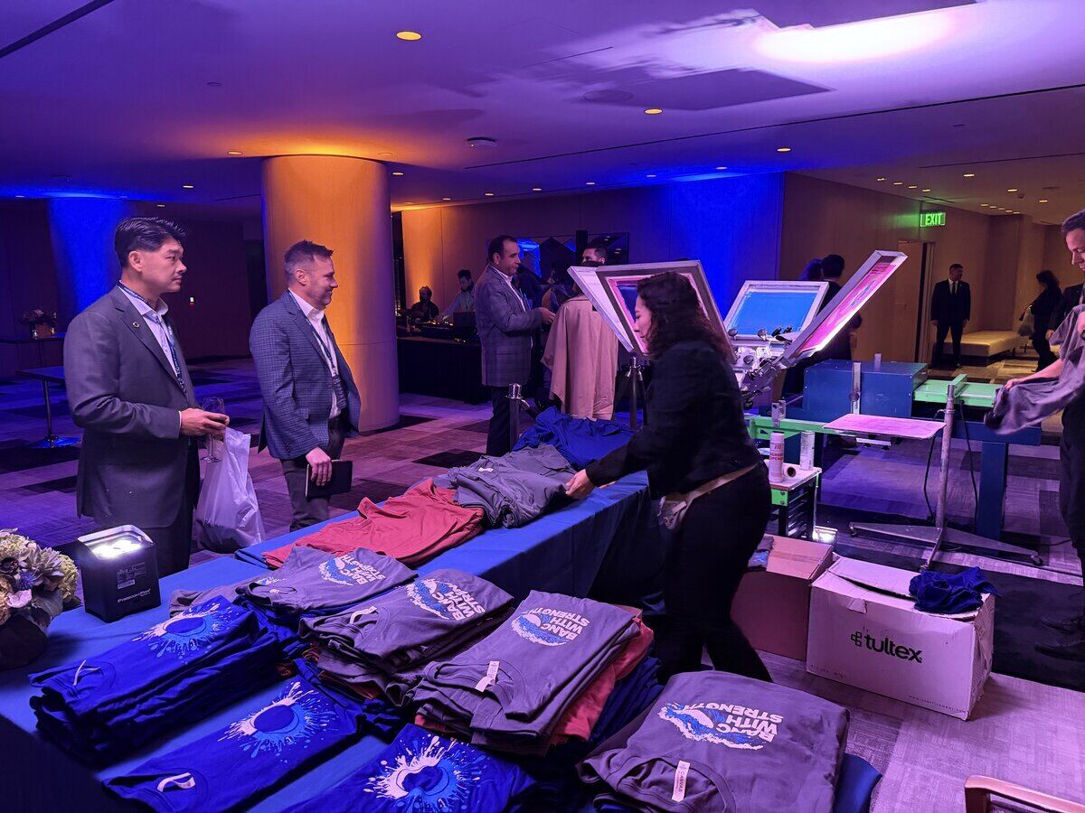Merch Troop crew staging a rented booth before an event opens