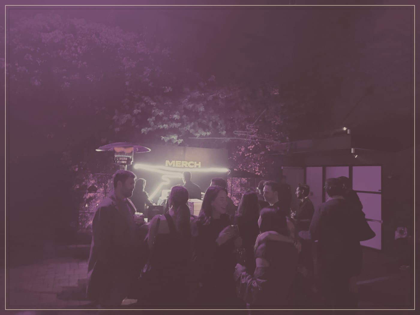 Garden-party merch booth set up outdoors with a compact footprint